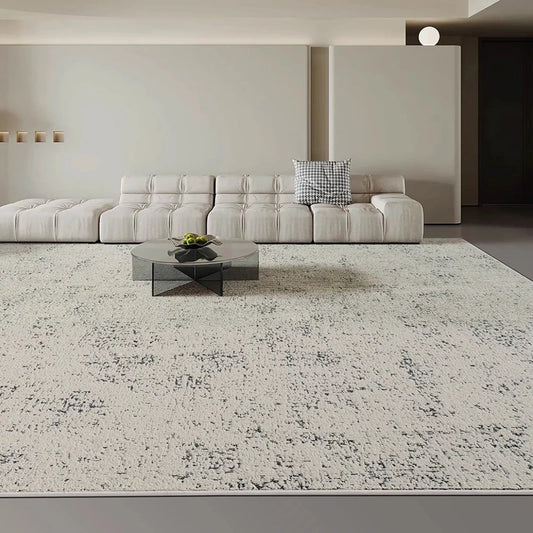 Gray and white patterned area rug in a minimalist living room with neutral tones and modern furniture #Texture_Gradient Gray