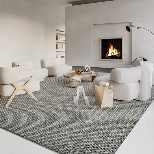 Gray and white diamond-pattern area rug styled in a modern living room with cozy furniture and a fireplace #Texture_Black & White Checks