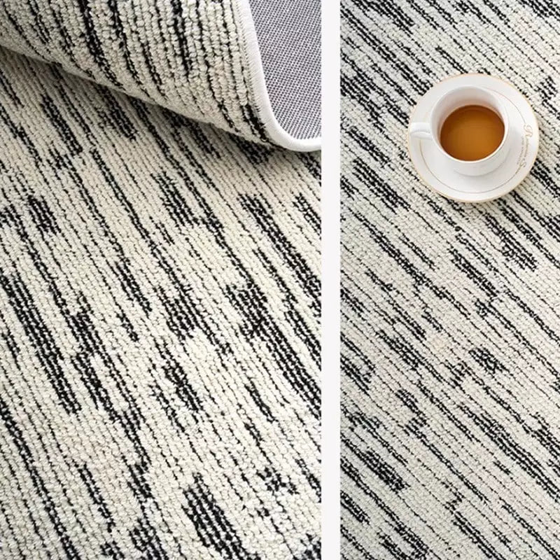 Black and ivory striped area rug with durable cotton backing, perfect for modern living spaces #Texture_Abstract Lines