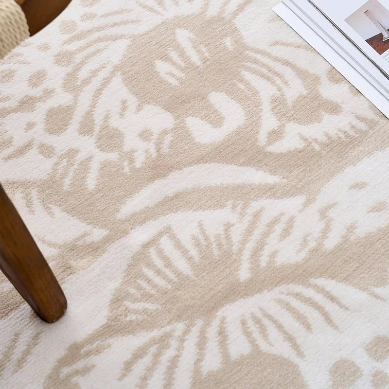 Close-up of beige floral rug showing intricate texture and design details