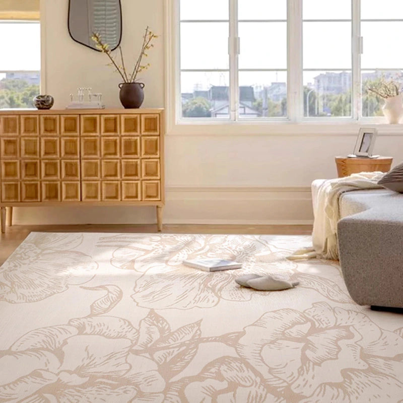 Beige floral rug in a bright living room with modern furniture and a natural aesthetic