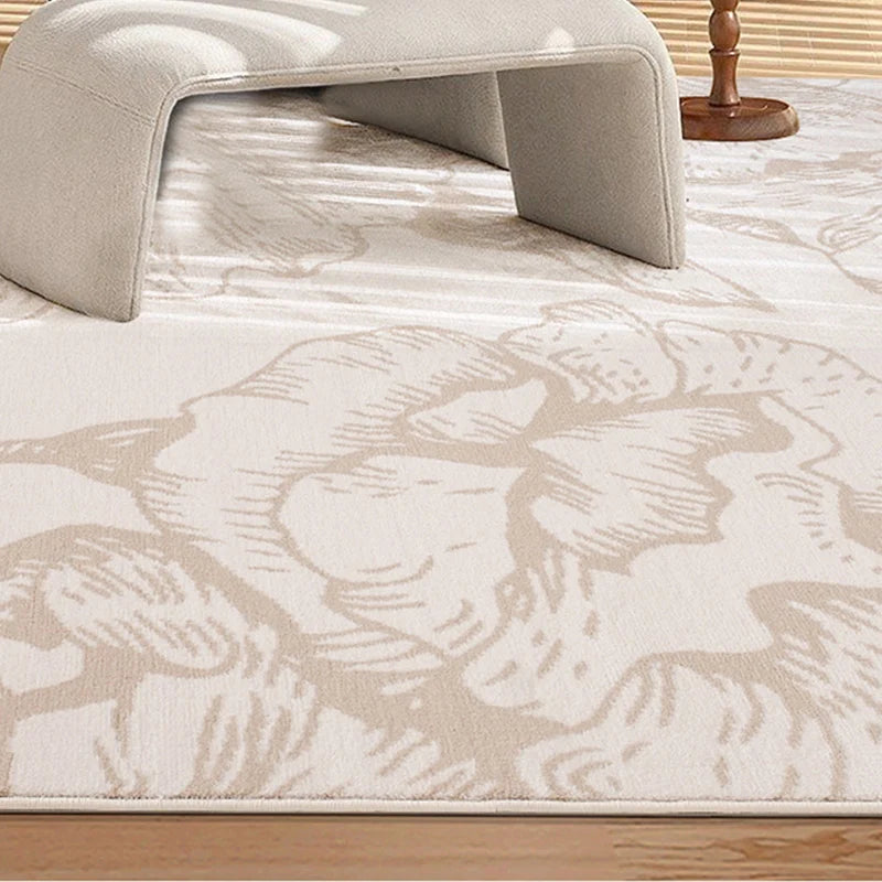 Close-up of a beige floral patterned rug under modern minimalist furniture