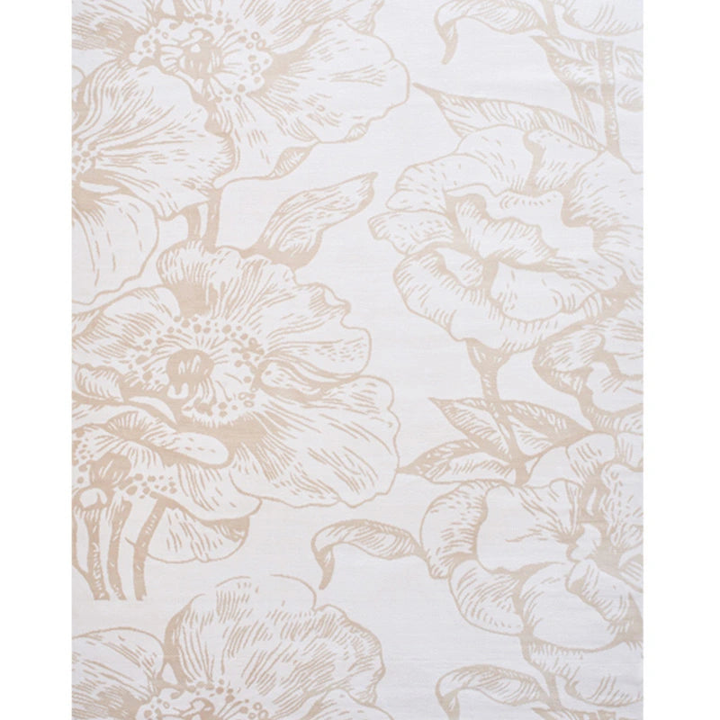 Top view of a beige floral pattern rug with intricate details