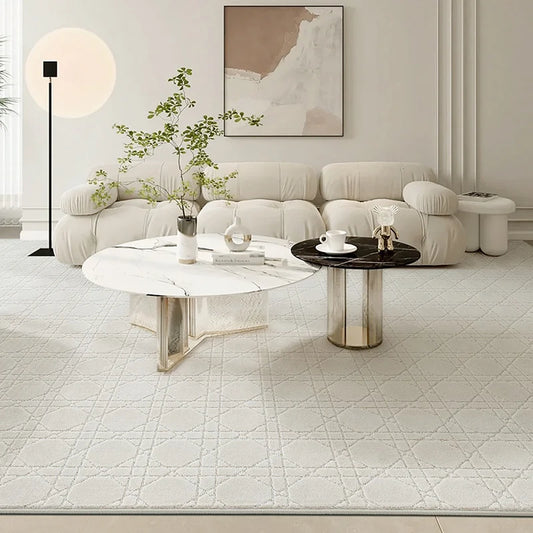 A modern beige rug with intersecting line patterns in a cozy living room, paired with a white plush sofa and stylish marble coffee tables#Texture_Crosshatch