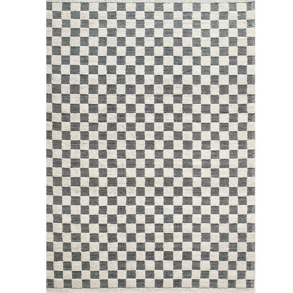Black and ivory checkerboard wool blend rug with chunky high-low loop texture