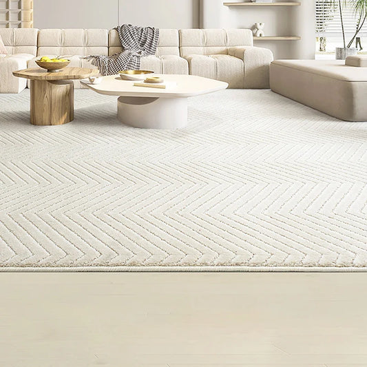 Chevron pattern rug in a modern living room with neutral-toned furniture and wooden coffee tables#Texture_Herringbone