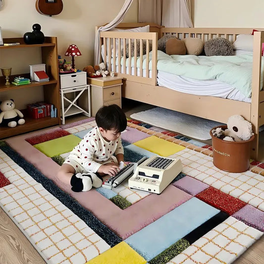 Boy playing with vintage typewriter on bold color-block rug in a cozy kids bedroom.