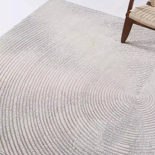 Detailed view of a gray rug with concentric circle patterns, highlighting its elegant texture and minimalist design #texture_Harmonic Circle