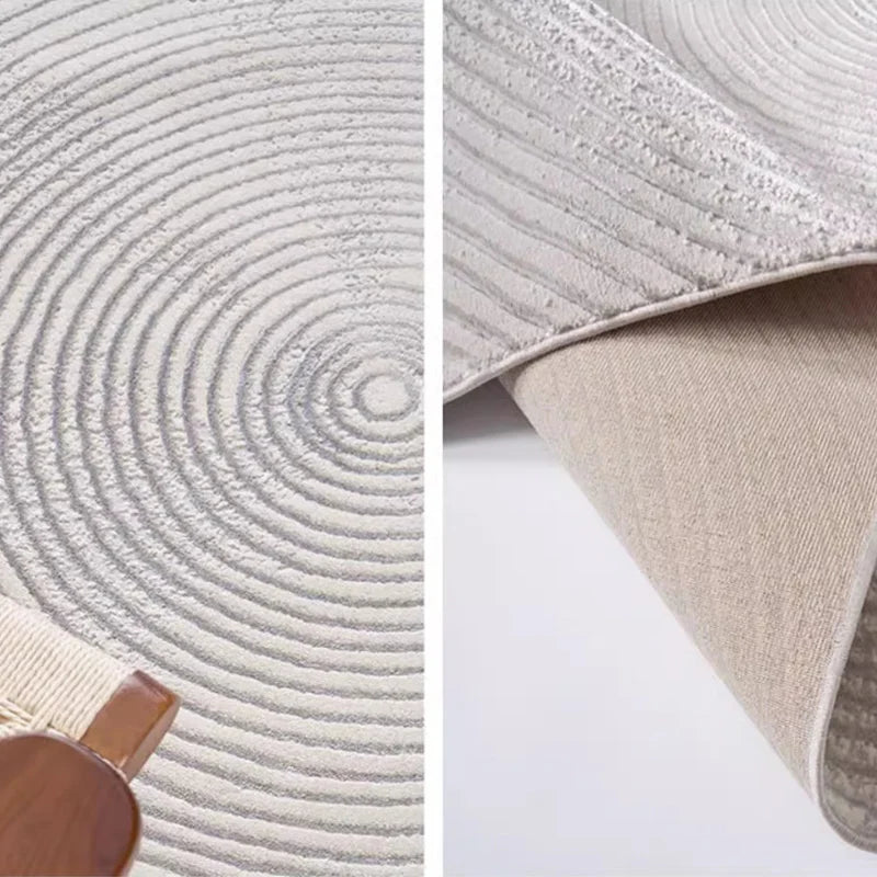 Close-up of a gray rug featuring a concentric circle texture and durable backing, highlighting craftsmanship and quality #texture_Harmonic Circle