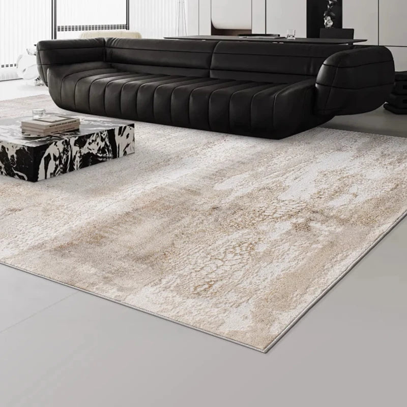 Modern beige area rug with textured patterns, paired with a sleek black leather sofa for contemporary interiors