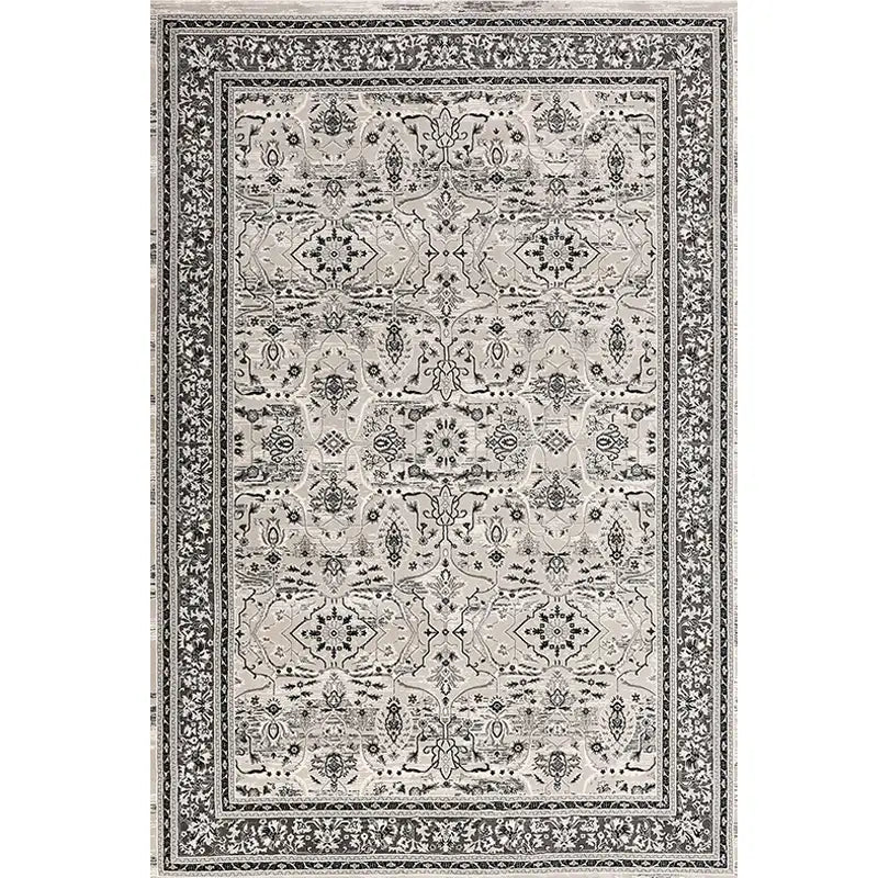 Top view of a Persian-style area rug with classic black and cream pattern