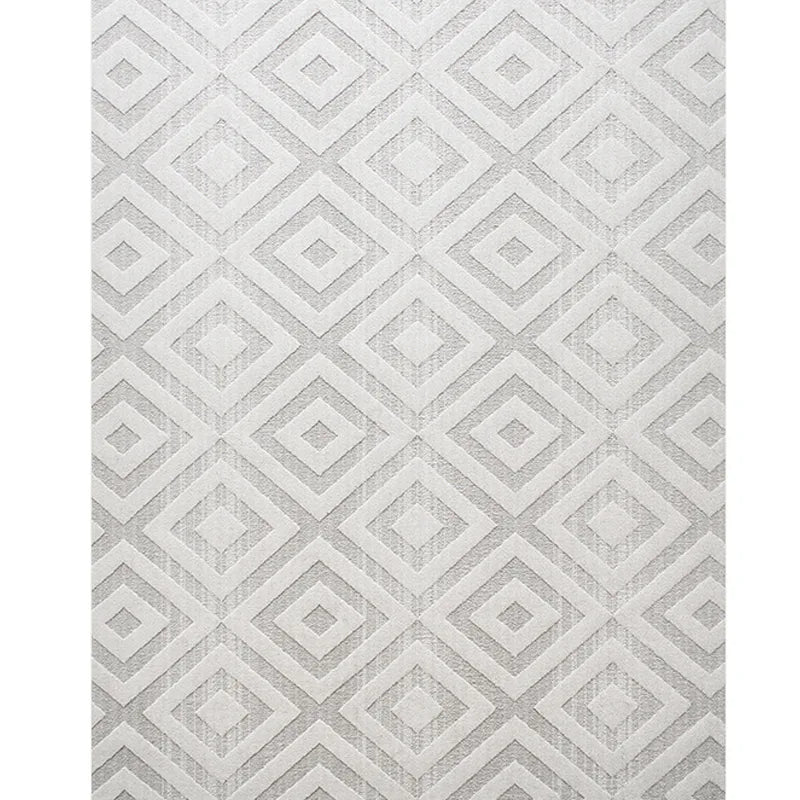 White area rug with geometric diamond patterns, featuring a minimalist and modern design