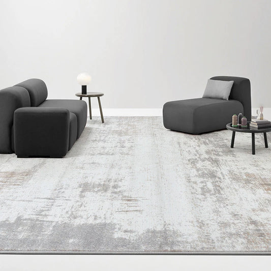 Gray abstract modern rug with subtle distressed patterns, perfect for minimalist living rooms