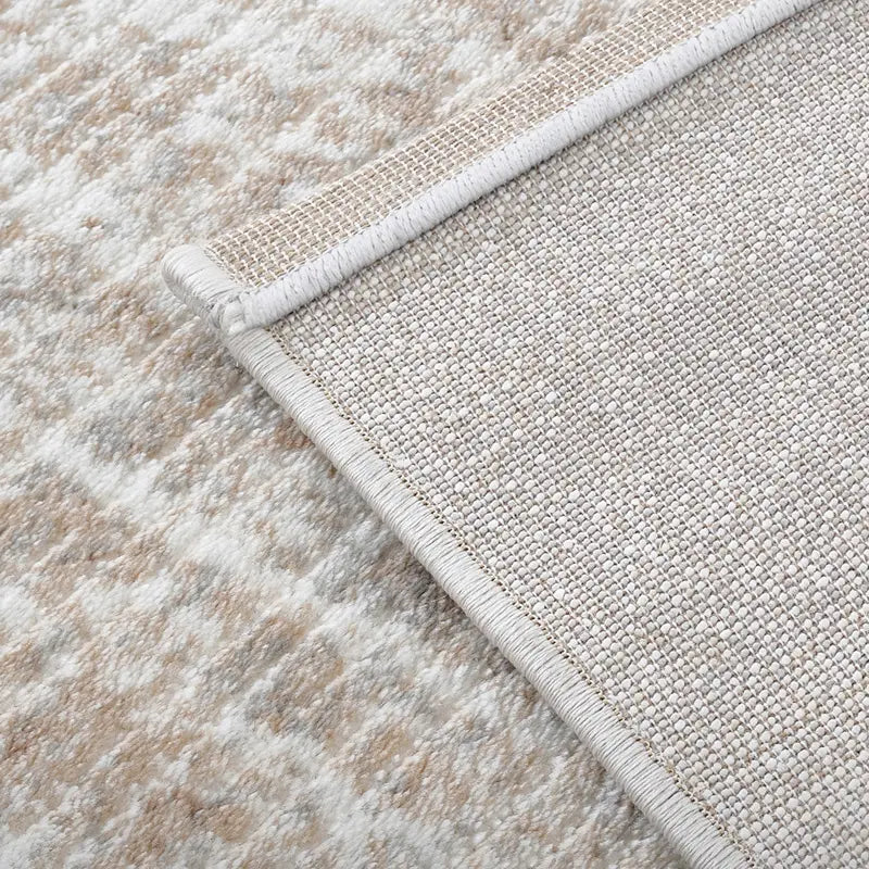 Close-up of the gray abstract rug's jute backing, highlighting the durable non-slip material