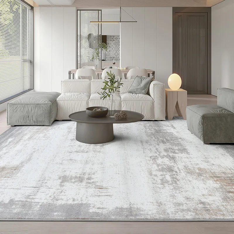 Modern gray abstract rug in a minimalist living room, enhancing the cozy and sophisticated decor