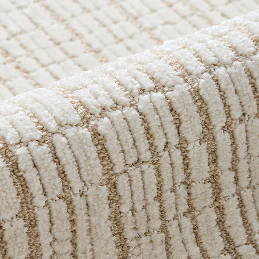 Close-up of a New Zealand wool blend area rug featuring a textured cut and loop construction