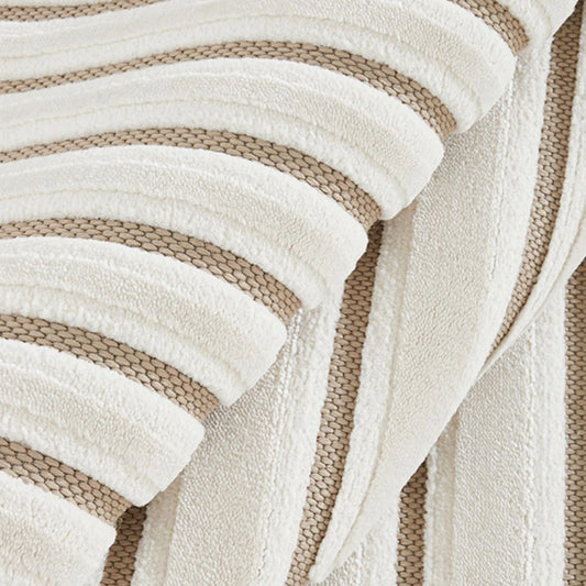 Ivory taupe high low geometric line rug showing raised pile and recessed woven detail