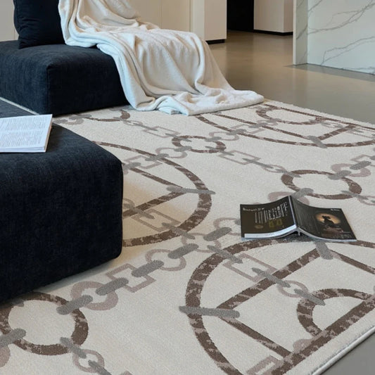 Modern chain-pattern rug in minimalist home interior with black low sofa and open magazine