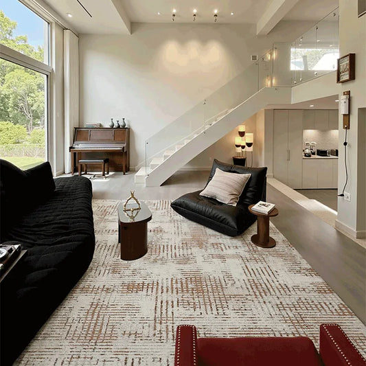 Spacious modern living room styled with an Italian-inspired area rug featuring clean geometric patterns and neutral tones