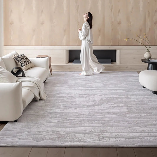 Modern minimalist area rug in a bright living room creating a calm and comfortable atmosphere