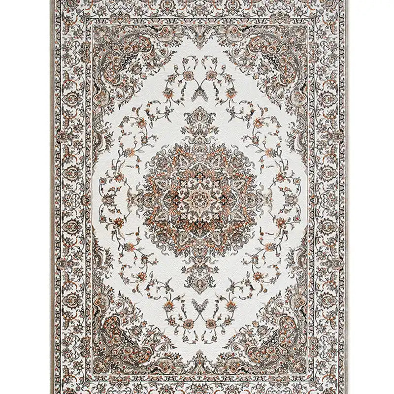 Top-down view of a Persian-style area rug with intricate floral medallion design