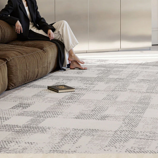 soft cream geometric area rug in a modern living room by Tervannor