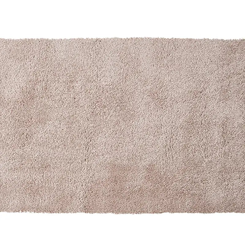 Soft pink shaggy rug with a delicate texture, adding warmth and elegance to any room #color_Blush Beige