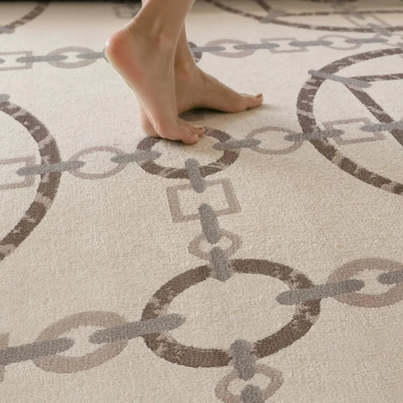 Soft chain-pattern rug under bare feet, demonstrating comfort and textur