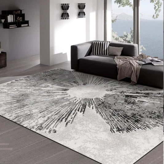 A modern coastal living room featuring a sunburst-patterned gray rug, adding texture and elegance to the space #texture_Solar Bloom
