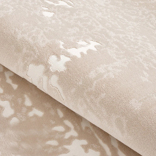 Taupe ivory abstract area rug detail showing bound edge and soft low-pile surface
