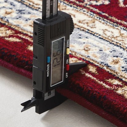 measurement tool showing rug thickness around 12mm