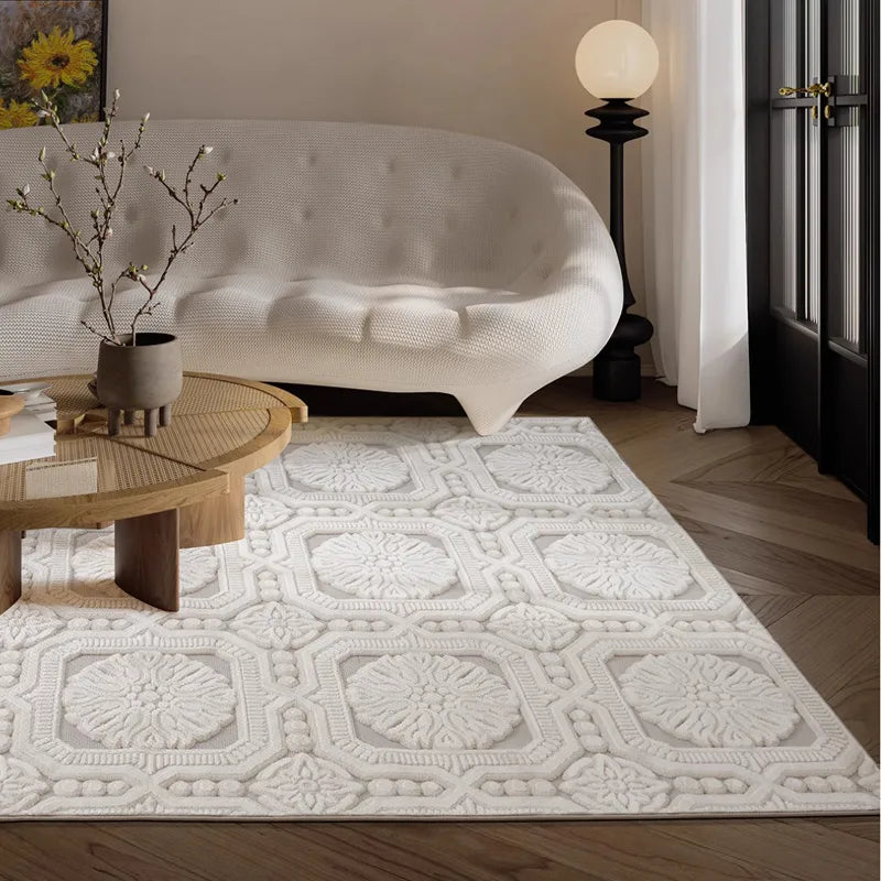 A French-inspired white relief rug with intricate floral and geometric patterns, placed in a cozy living room with modern furniture and soft lighting #Series_Classic Relief