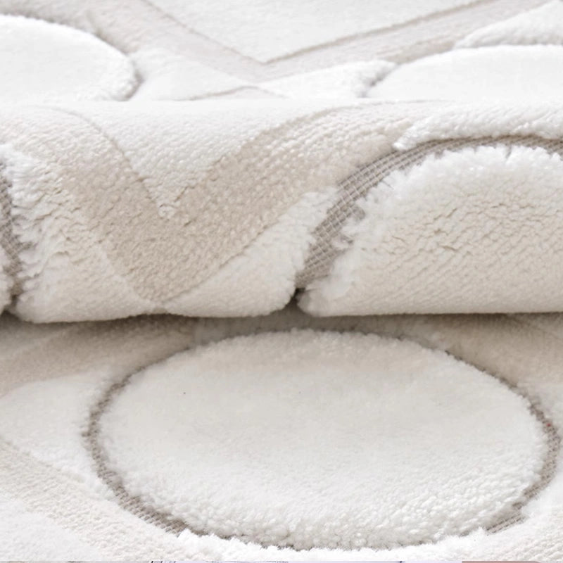 Soft-textured rug with geometric circular and square patterns, featuring a neutral white tone and a decorative vase on top, highlighting its artistic and minimalistic design #Series_Modern Geometry