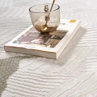 Close-up of a modern 3D woven area rug with a soft textured surface in neutral beige tones, highlighting its intricate pattern, plush feel, and premium craftsmanship