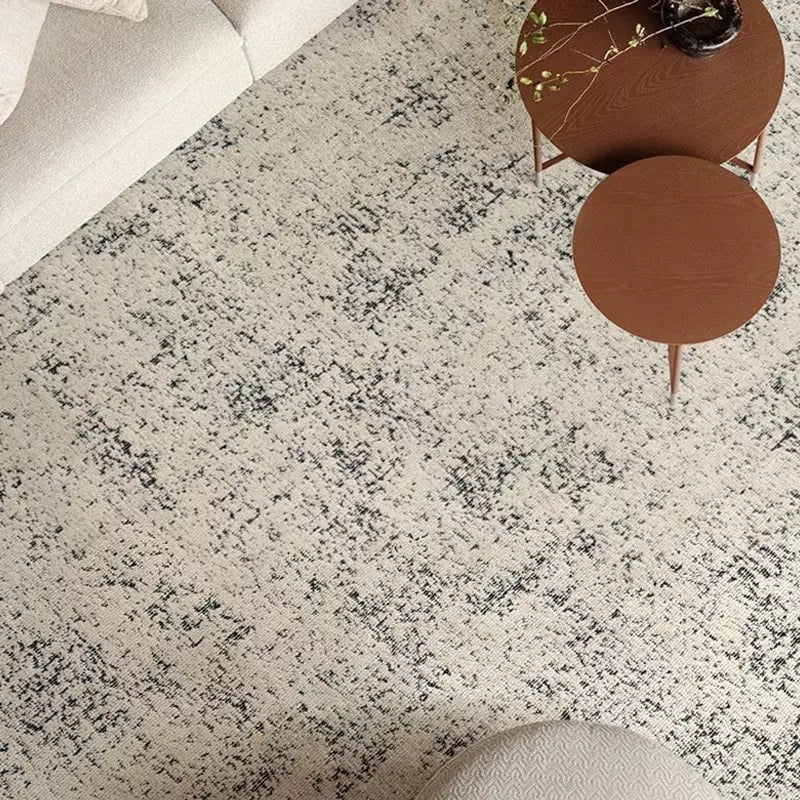 Ivory and black modern area rug with distressed pattern, perfect for minimalist living room decor #Texture_Gradient Gray