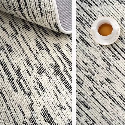 Black and ivory striped area rug with durable cotton backing, perfect for modern living spaces #Texture_Abstract Lines