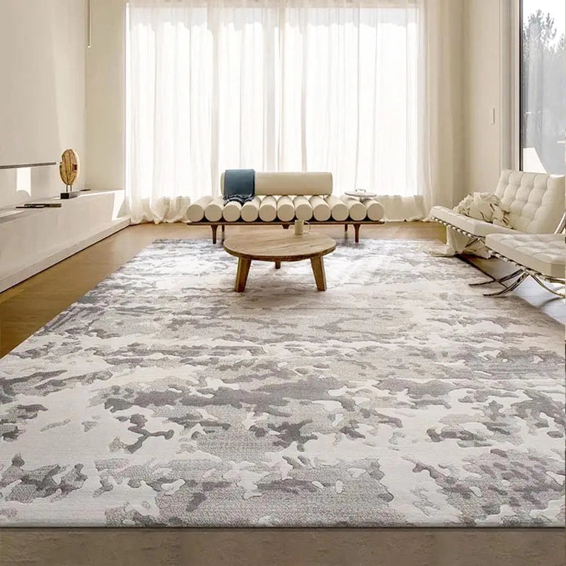 Abstract gray rug in a modern living room with a wooden coffee table and white seating by large windows #Texture_Stormy Texture