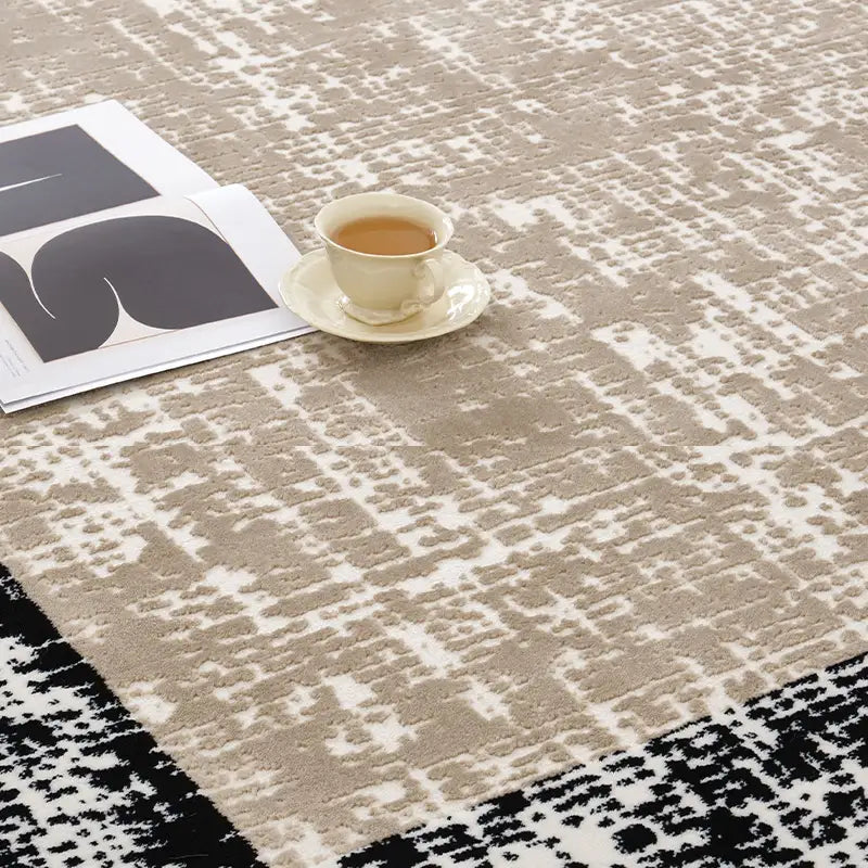 Close-up of a modern beige and black border rug showcasing its intricate texture and pattern #color_beige