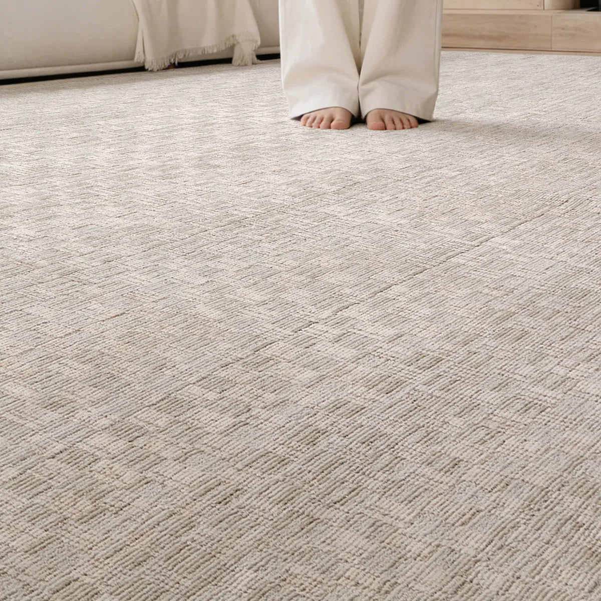 Beige crosshatch woven rug shown underfoot with a soft textured surface