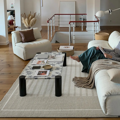 Beige minimalist living room rug with a thick textured weave and calm neutral style