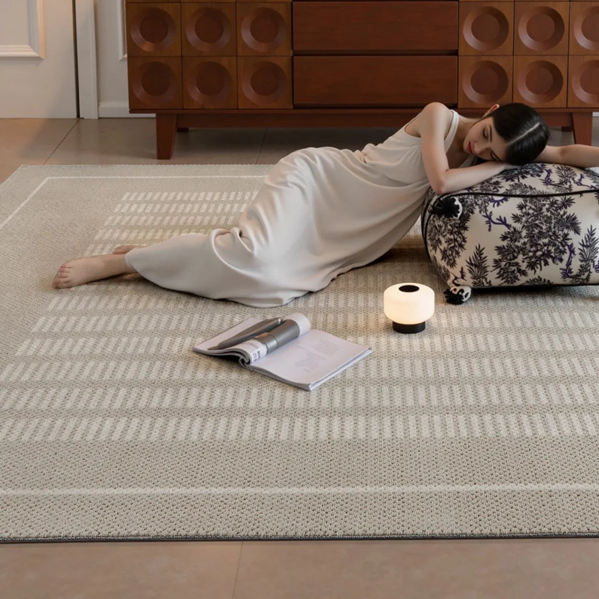 Beige geometric area rug with a soft woven texture in a warm modern living room