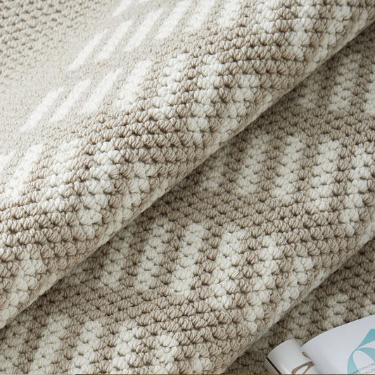 Beige loop texture rug with a dense woven surface and subtle geometric detailing
