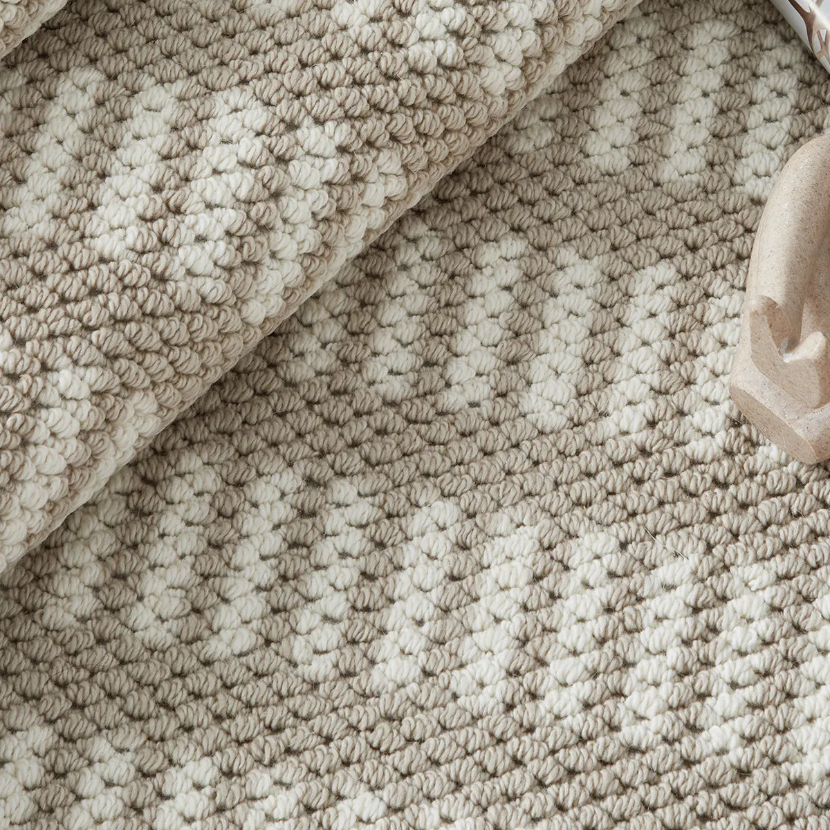 Beige pattern detail rug with a soft woven texture and modern geometric design