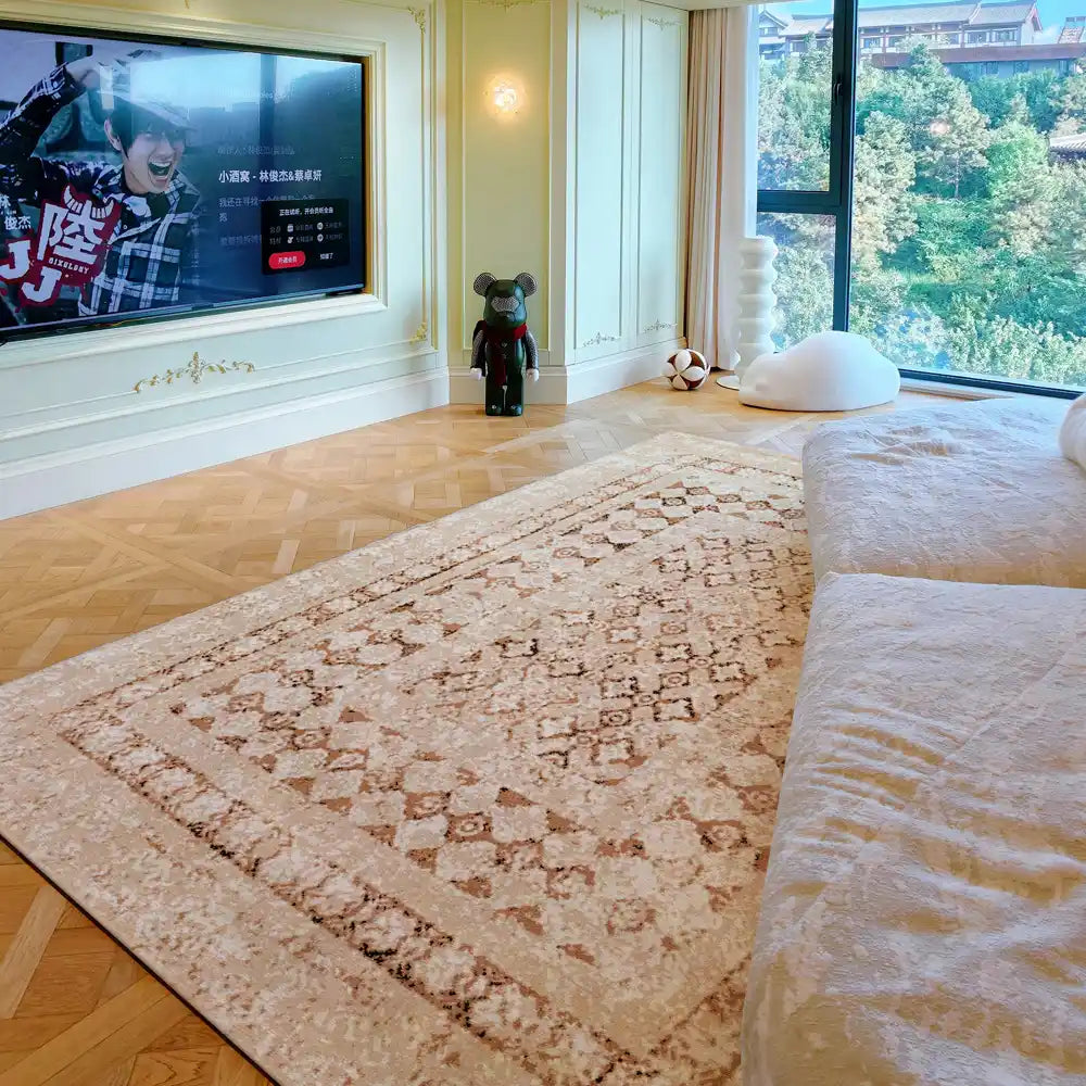 Beige Persian-style rug in a bright bedroom with wooden floor and large window view