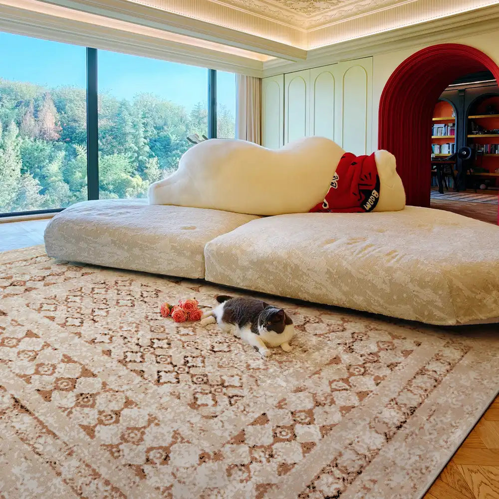 Beige Persian-style rug in cozy living room with cat and natural sunlight