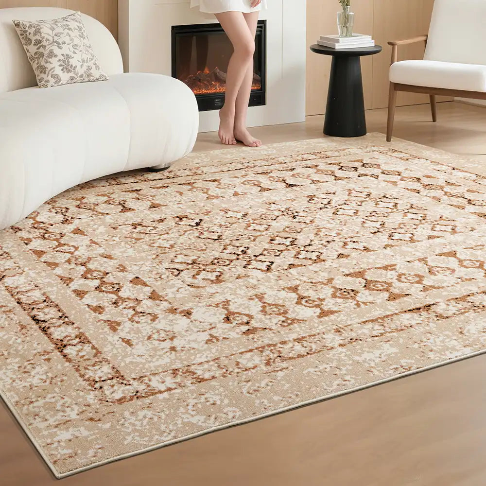 Beige patterned rug beside sofa and fireplace, cozy and warm interior