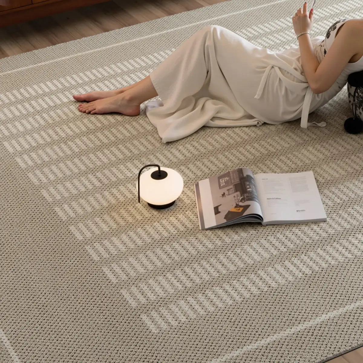 Beige geometric lounge rug with a soft woven texture in a warm modern interior