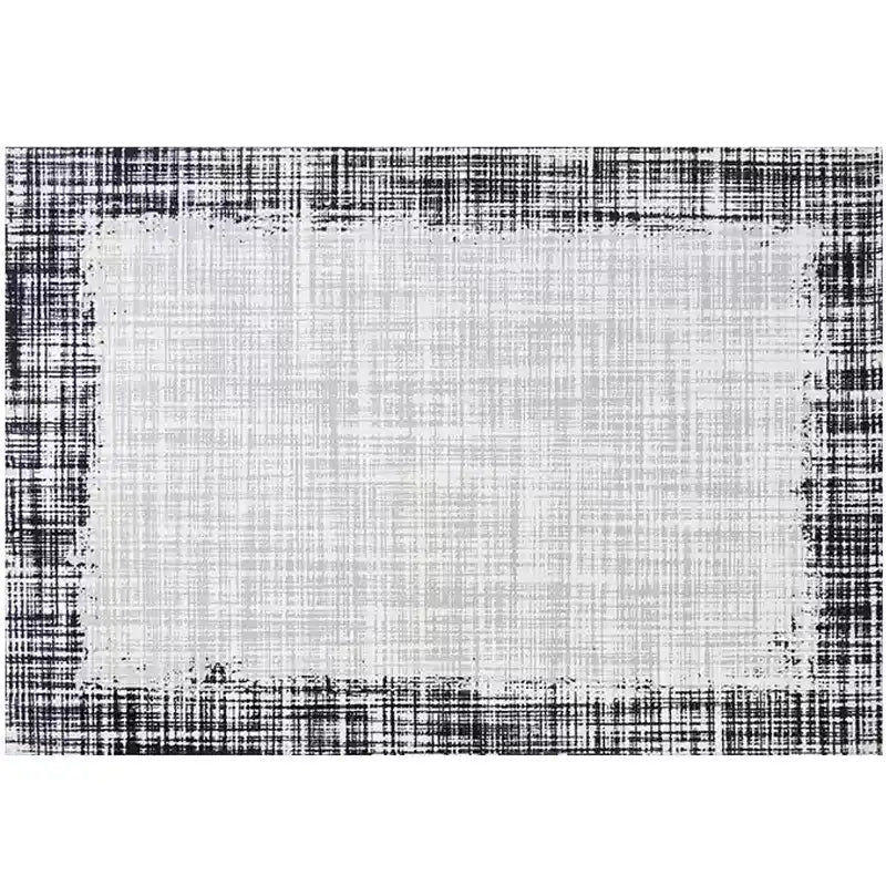 Modern area rug with a black-and-white border design, featuring a sleek and minimalistic pattern perfect for contemporary interiors #color_lvory