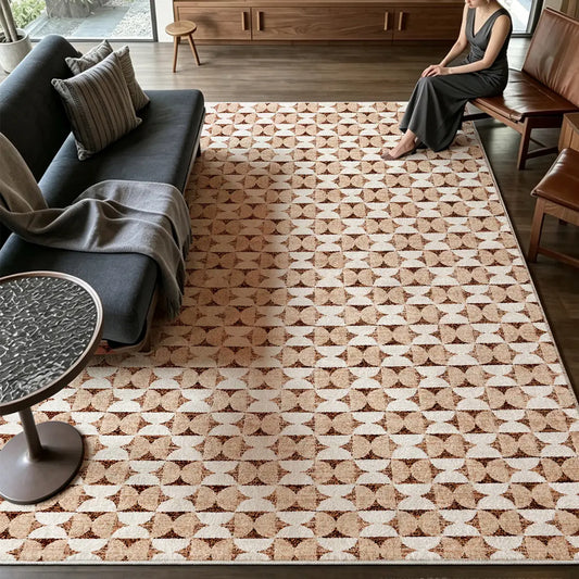 Brown geometric area rug styled in a modern living room with warm wood furniture and neutral décor.