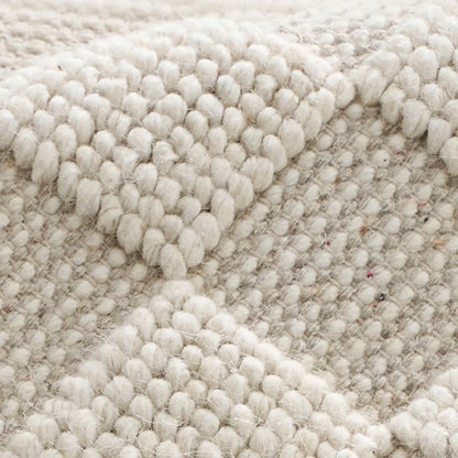 wool living room rug close up thick handwoven texture natural fiber breathable soft durable weave pattern detail